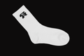 T-shirt with 'Certified by the Culture' text and a sock on a black background